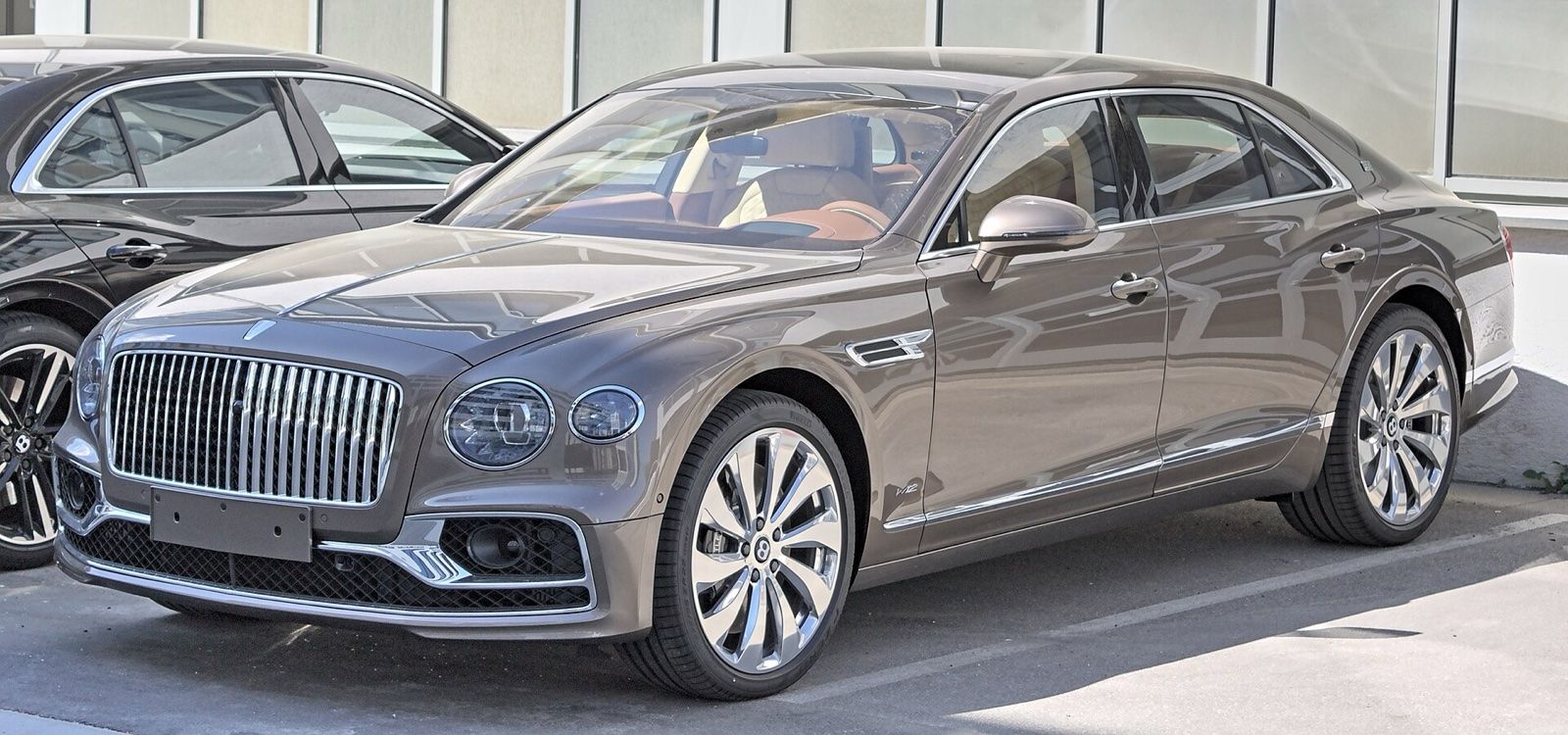 Bronze Bentley Flying Spur sedan, front three-quarter view