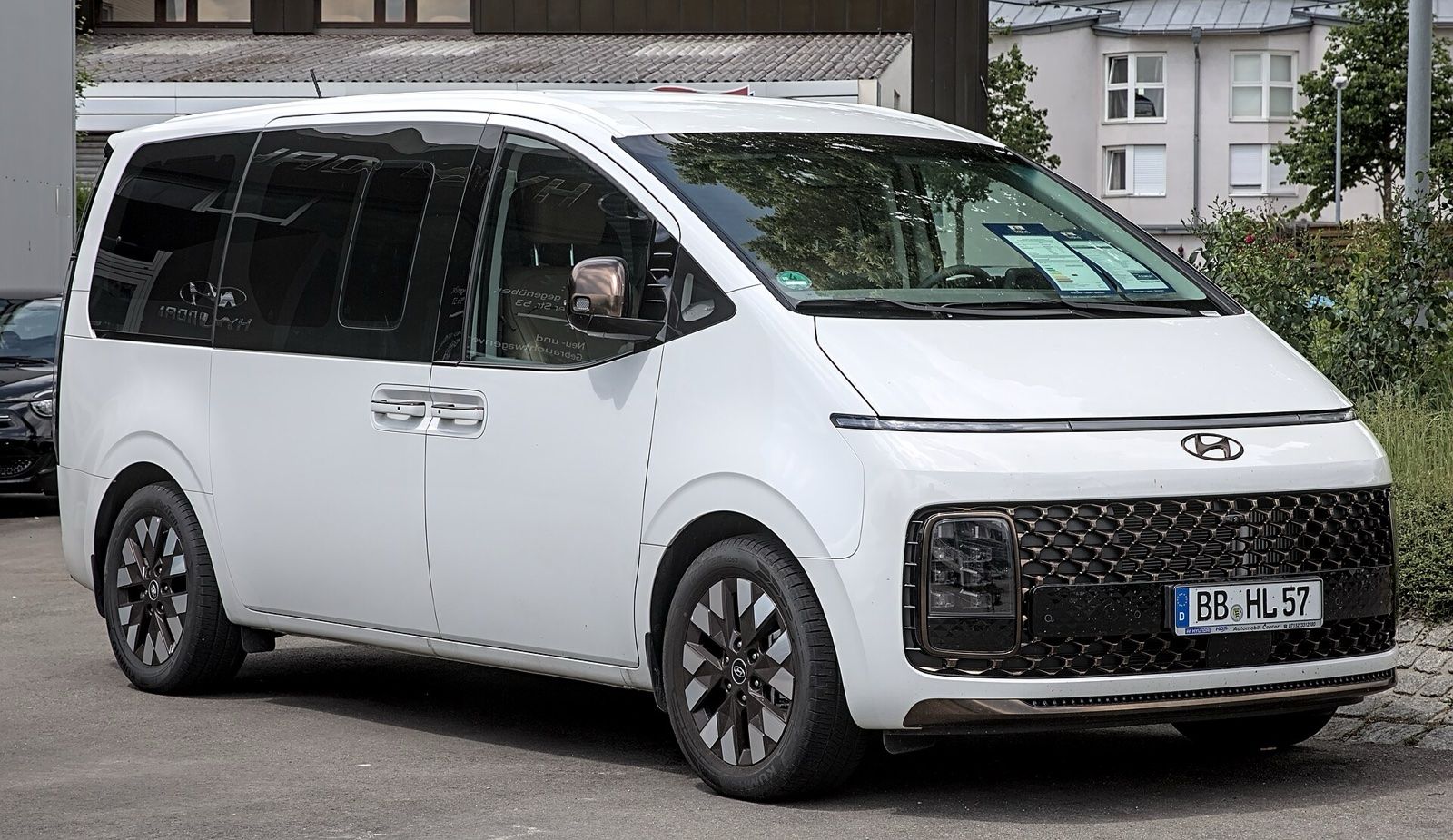 White Hyundai Staria minivan, front three-quarter view